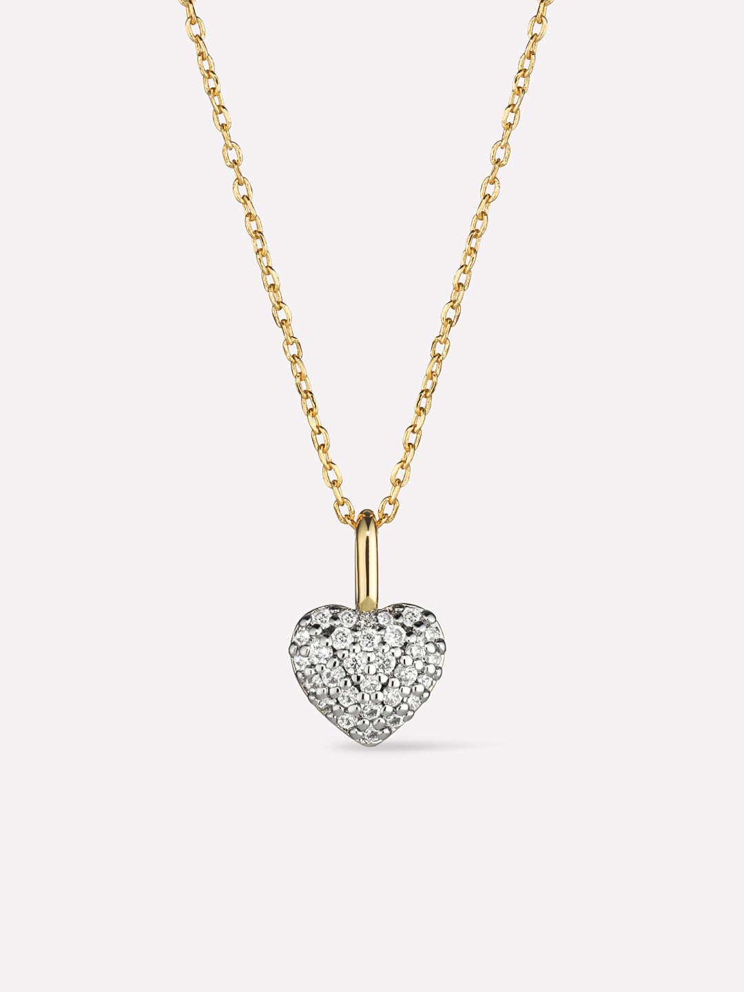 Heart-shaped diamond pendant on a gold chain against a white background
