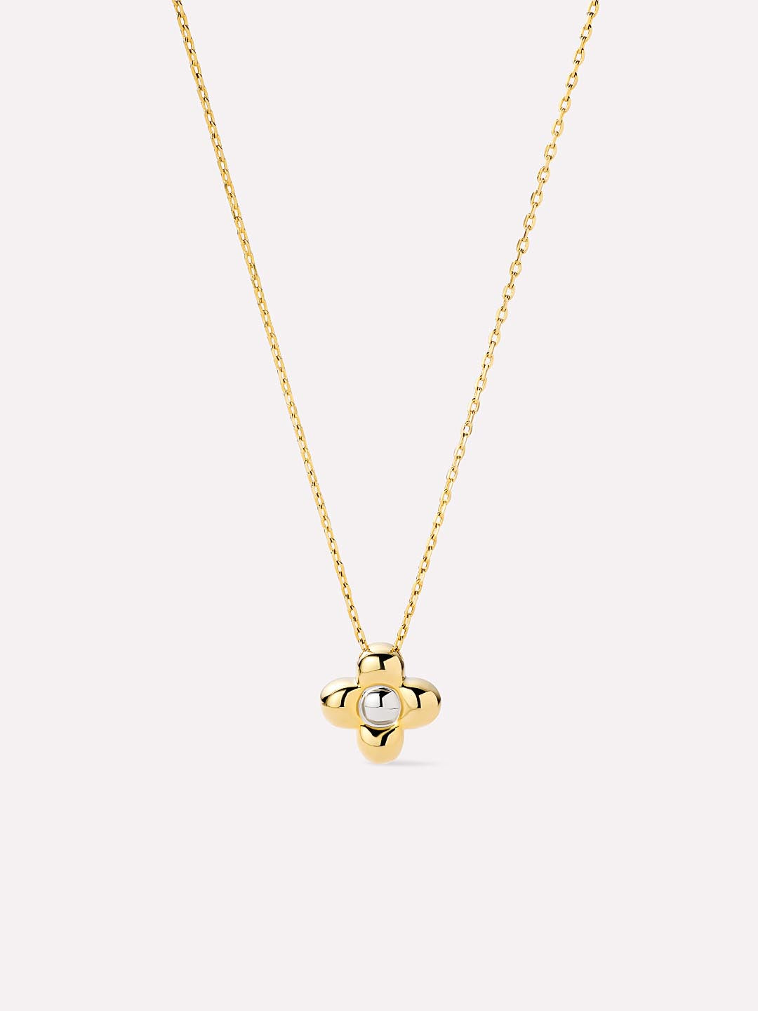 Gold necklace with a small pendant on a white background