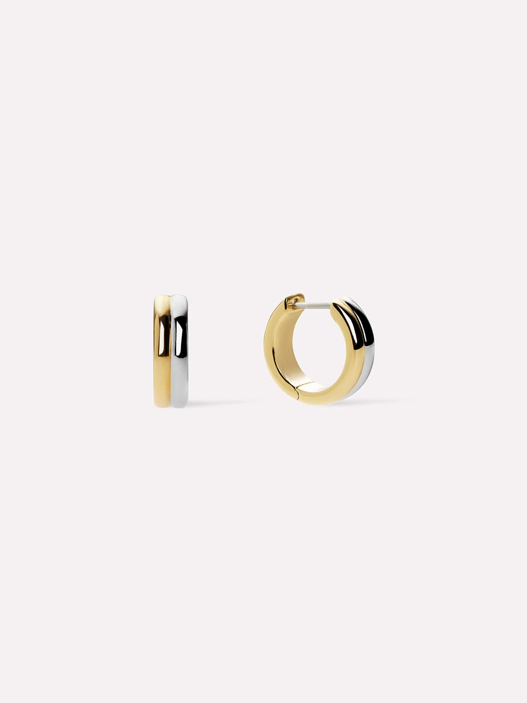 Two gold hoop earrings on a white background