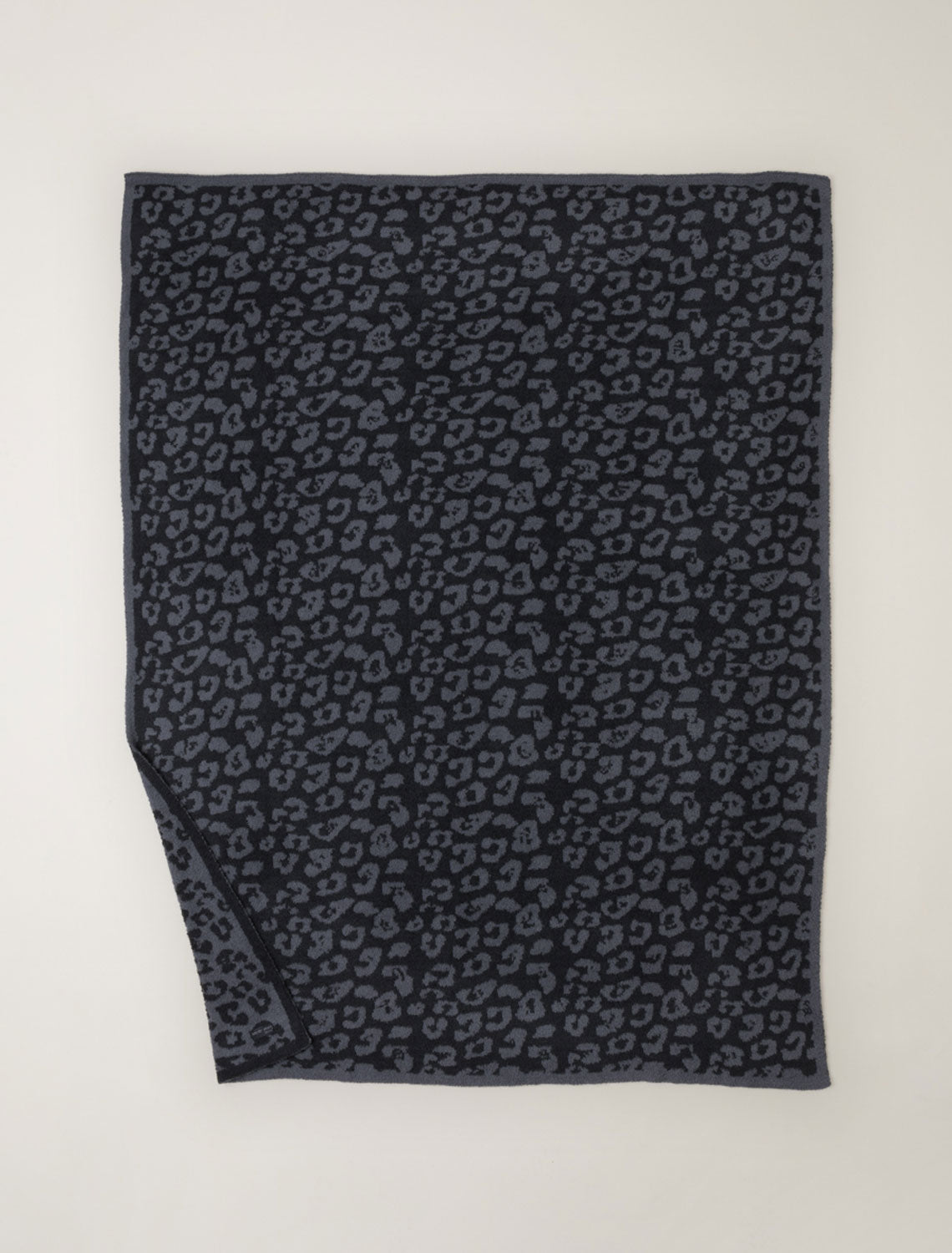 Black and gray patterned fabric on a white background