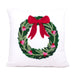 Decorative pillow with a Christmas wreath design featuring a red bow on a white background.
