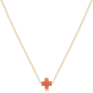 Gold necklace with a small cross pendant on a white background