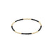 Bracelet with black beads and gold accents on a white background