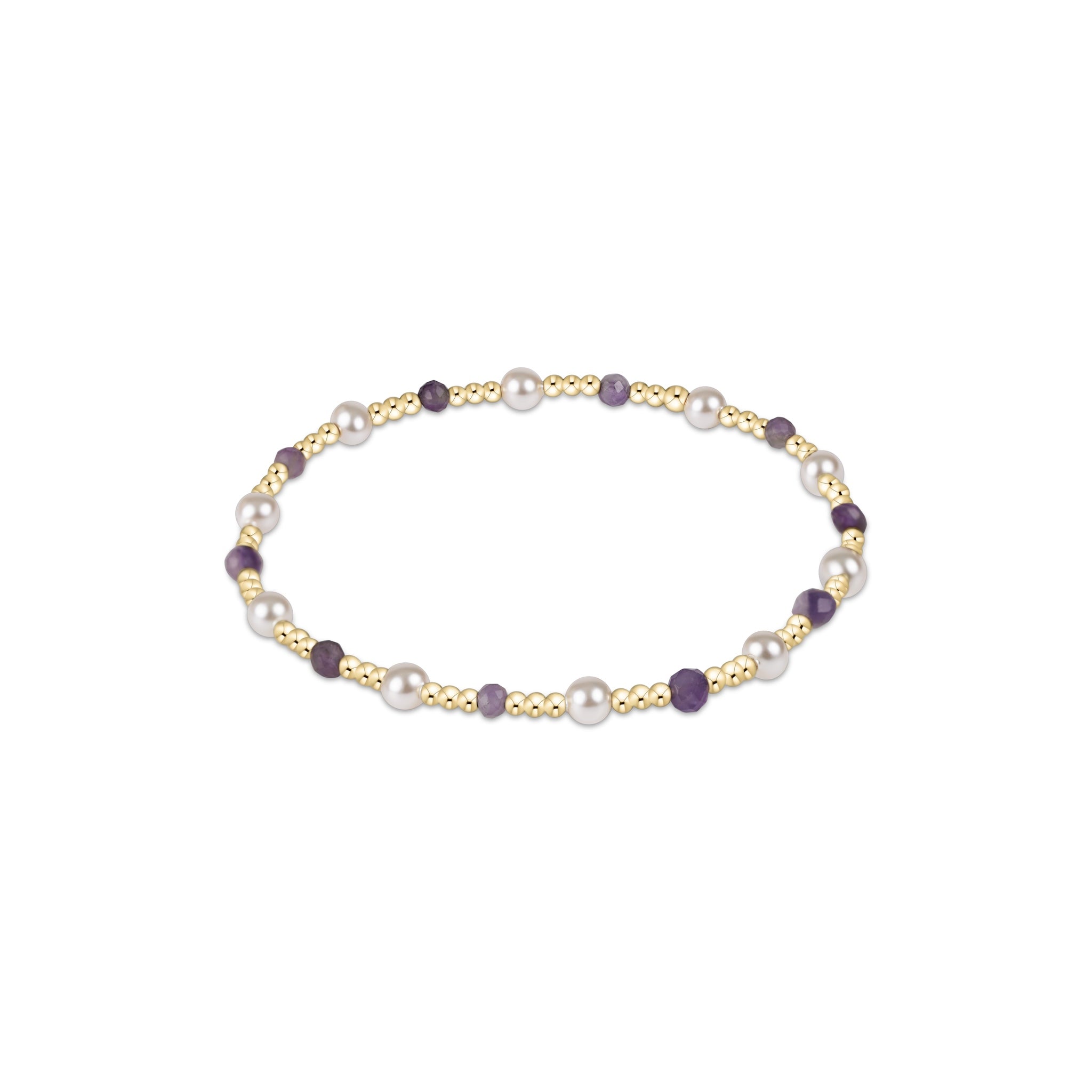 Bracelet with pearls and gold accents on a white background