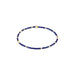 Navy blue beaded bracelet with gold accents on a white background