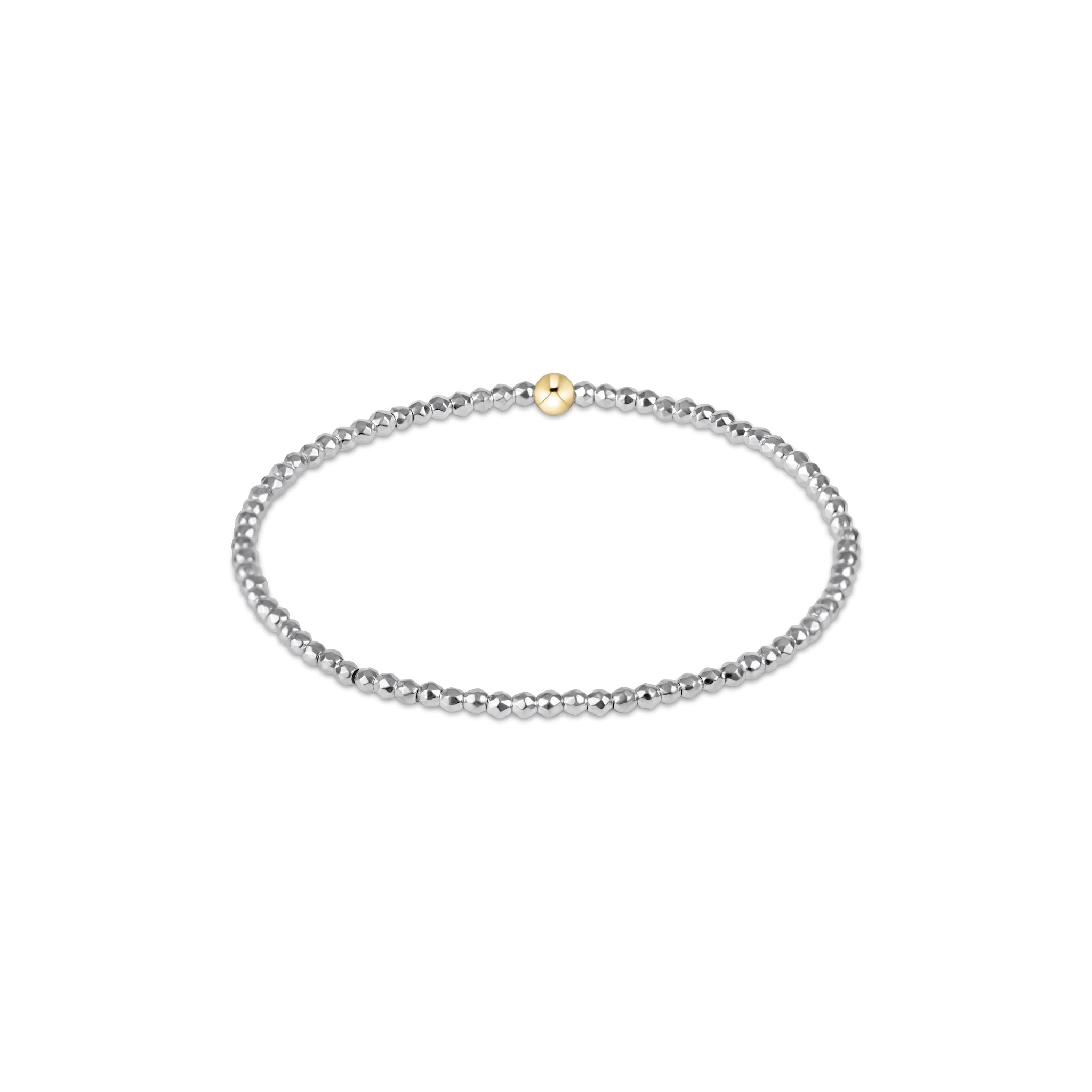 Silver beaded bracelet with a gold clasp on a white background