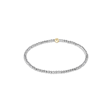 Silver beaded bracelet with a gold clasp on a white background