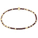 Bracelet with alternating brown and gold beads on a white background