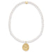 Pearl bracelet with a gold heart pendant on a white background