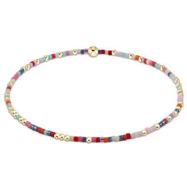 Multicolored beaded necklace with gold accents on a white background