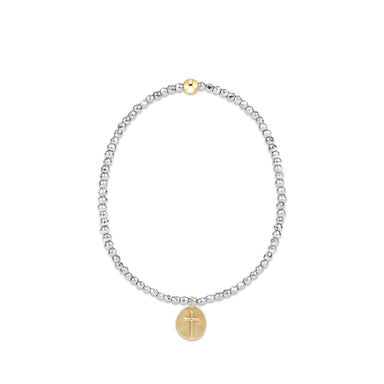Silver beaded bracelet with a gold cross charm on a white background