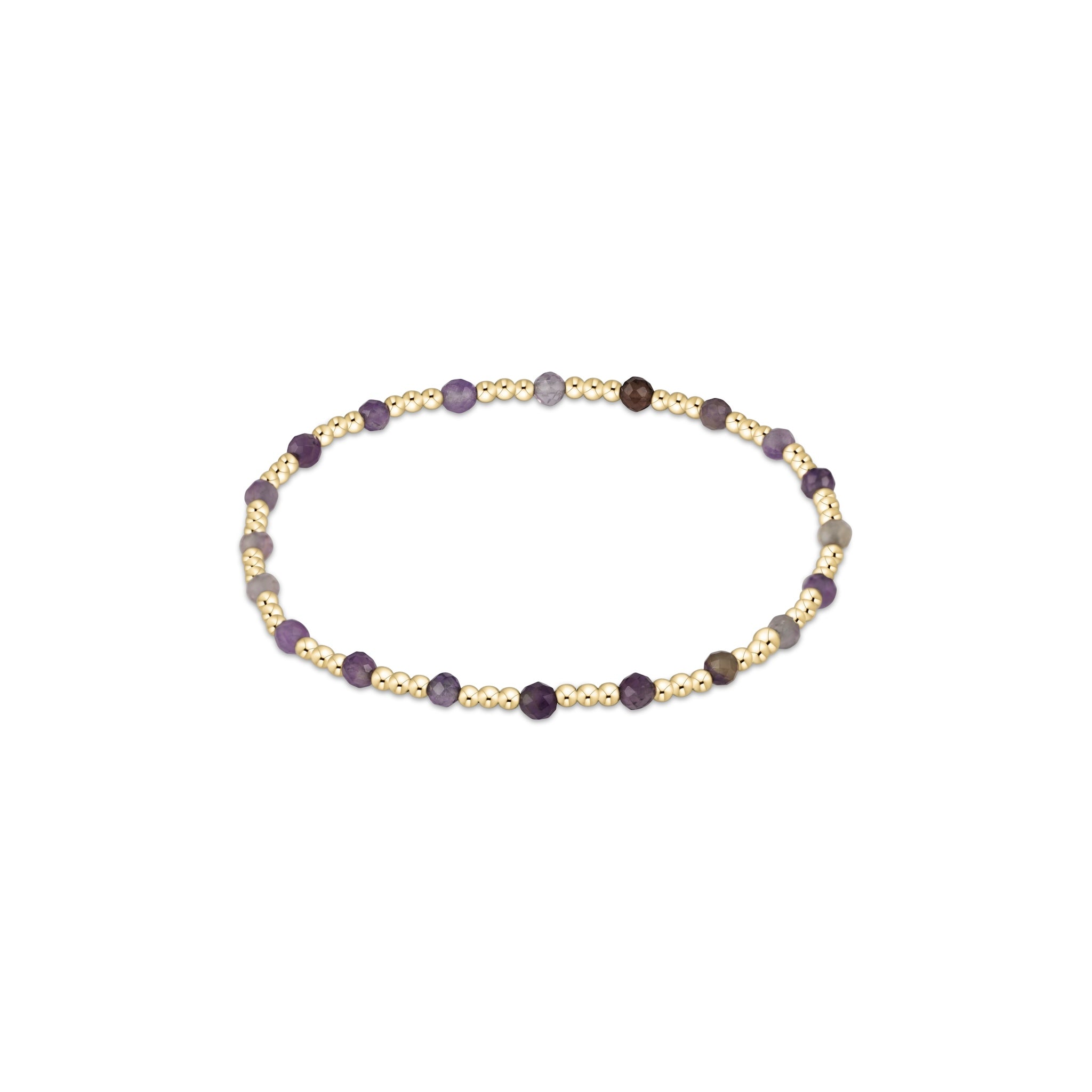 Bracelet with gold and purple beads on a white background