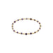 Bracelet with gold and purple beads on a white background