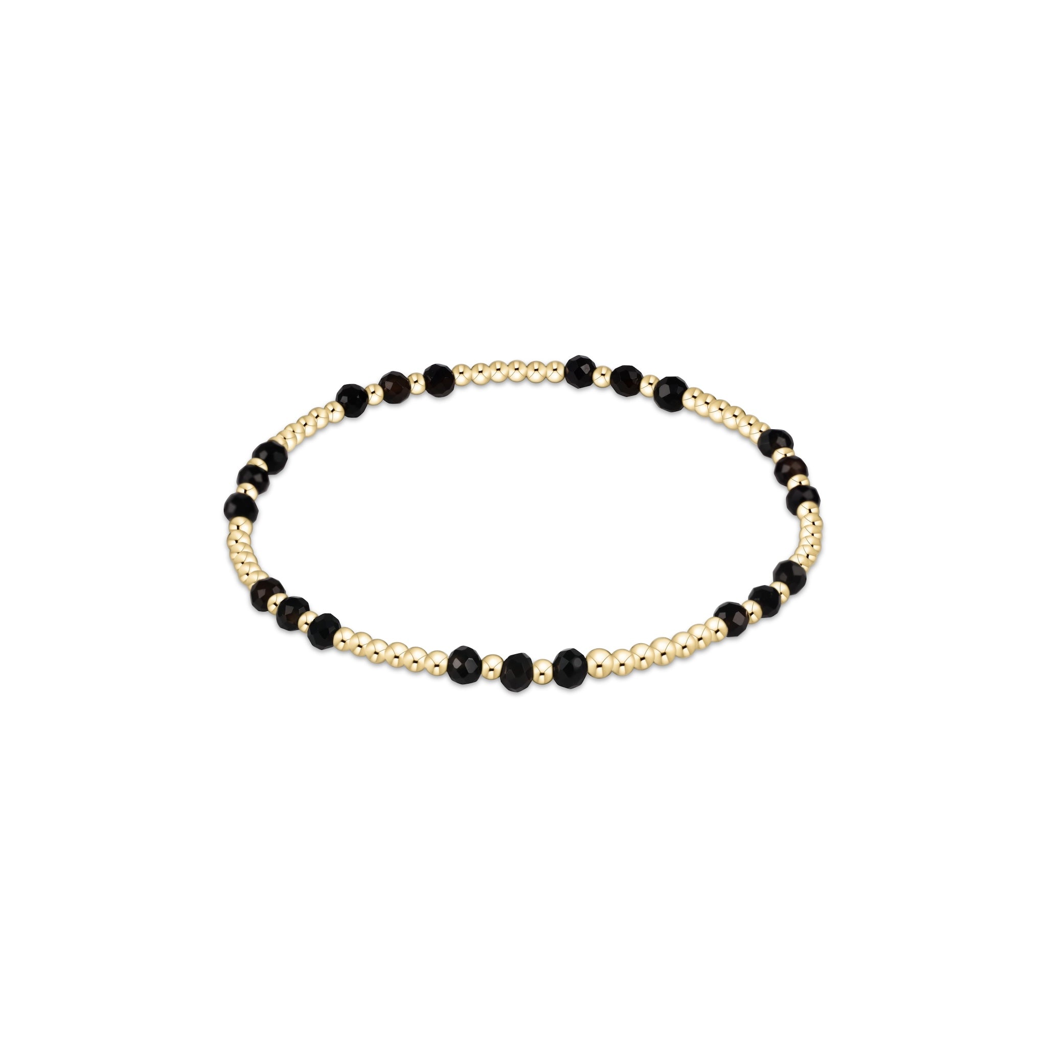 Bracelet with black beads and gold accents on a white background