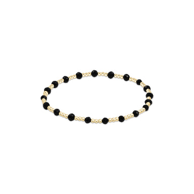bracelet with black and gold beads on a white background