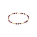 Bracelet with gold and purple beads on a white background