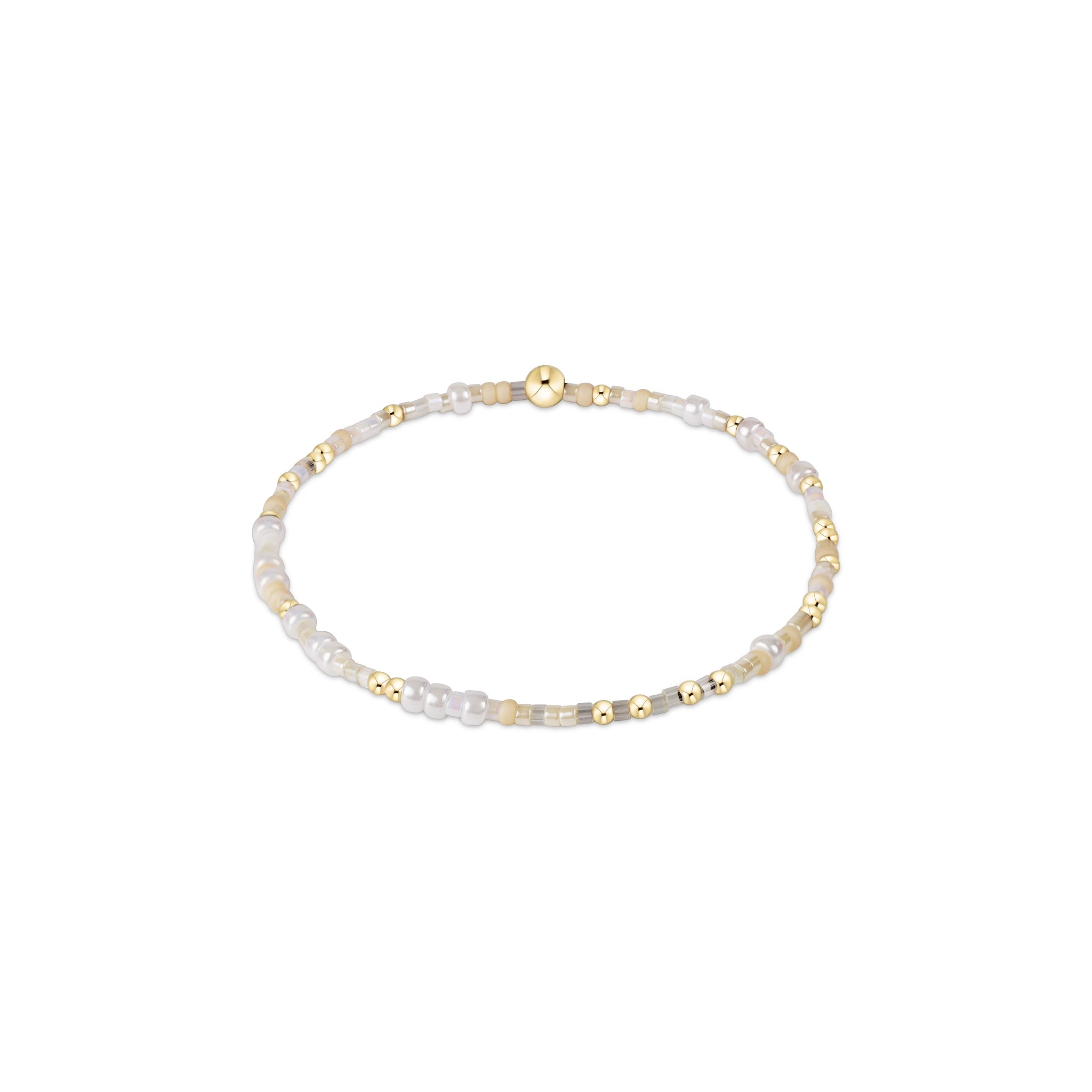 Delicate bracelet with gold and pearl beads on a white background