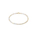 Delicate bracelet with gold and pearl beads on a white background