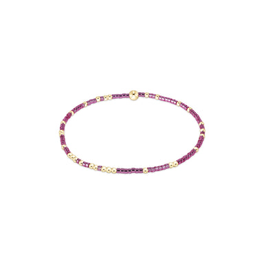 bracelet with pink and gold beads on a white background
