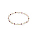 Bracelet with pearls and red gemstones on a white background