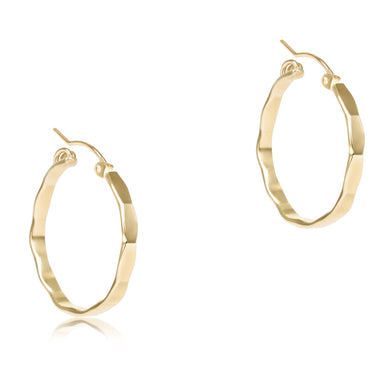 Gold hoop earrings on a white background