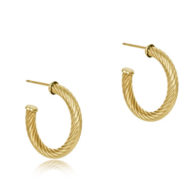 Gold hoop earrings on a white background