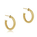 Gold hoop earrings on a white background