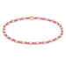 Bracelet with pink and gold beads on a white background