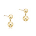 Pair of gold ball earrings on a white background