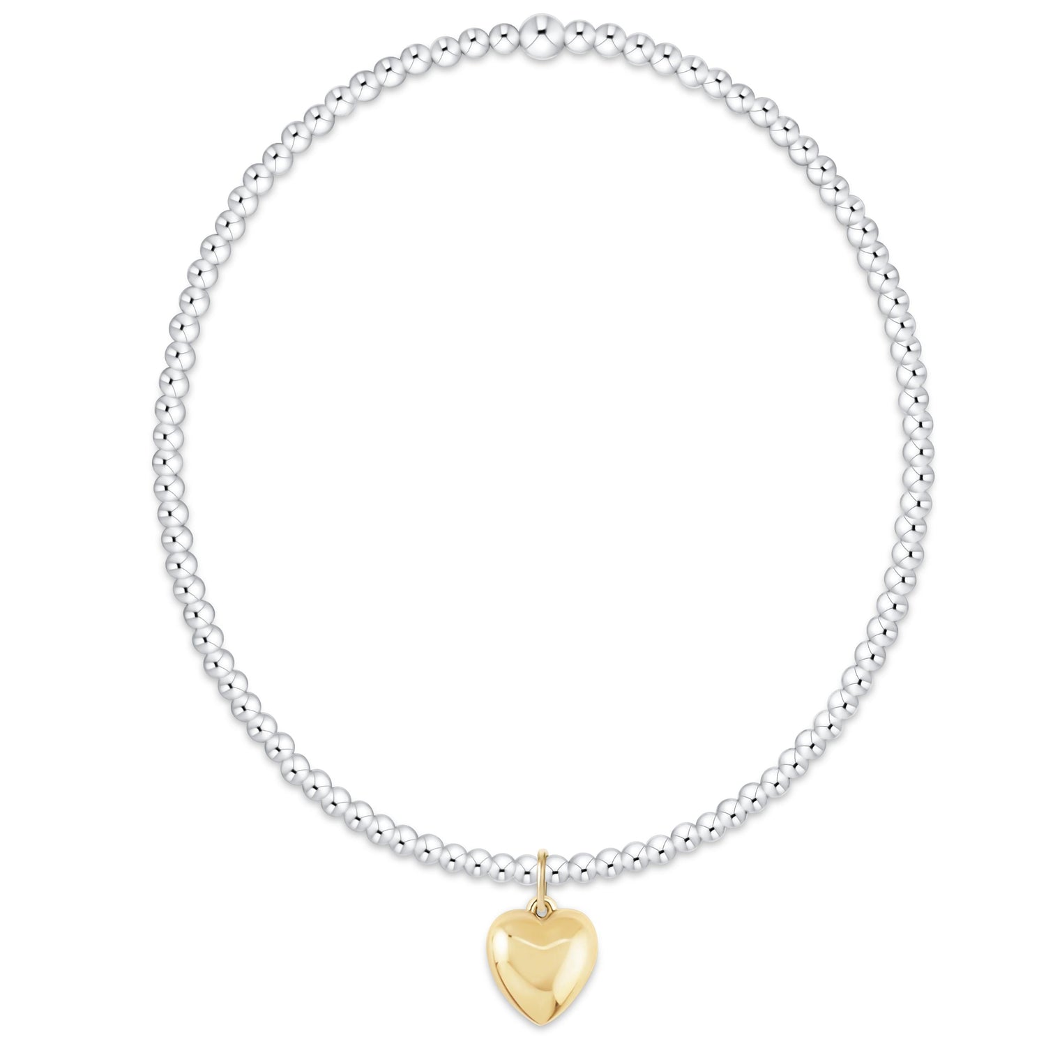 Bracelet with a gold heart charm on a white background