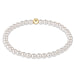 Pearl bracelet with a gold clasp on a white background