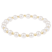 Pearl bracelet with gold accents on a white background