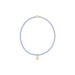 Delicate bracelet with a small gold charm on a white background