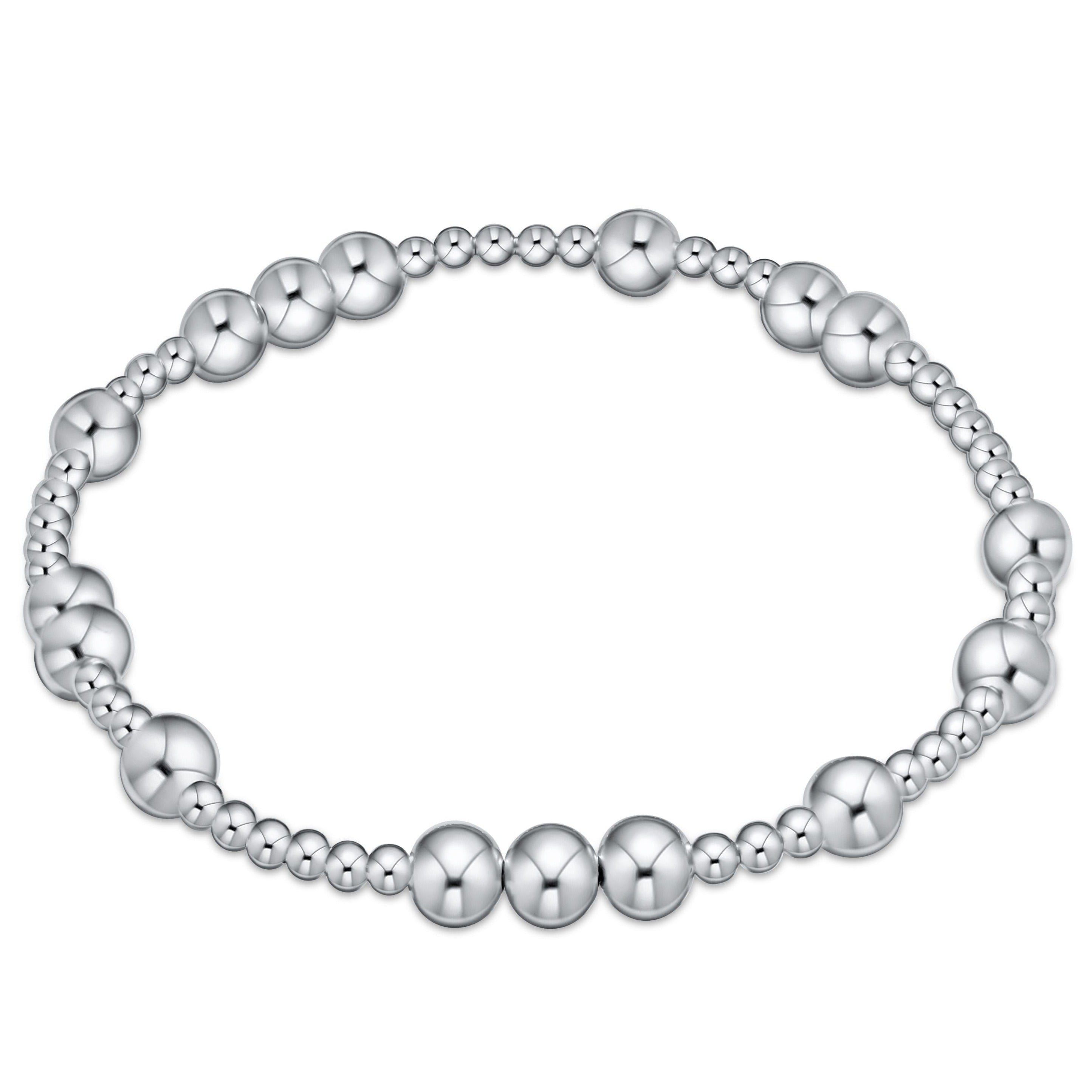 Silver beaded bracelet on a white background