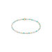 Beaded bracelet with white, blue, and gold beads on a white background