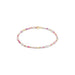 Bracelet with pink, white, and gold beads on a white background