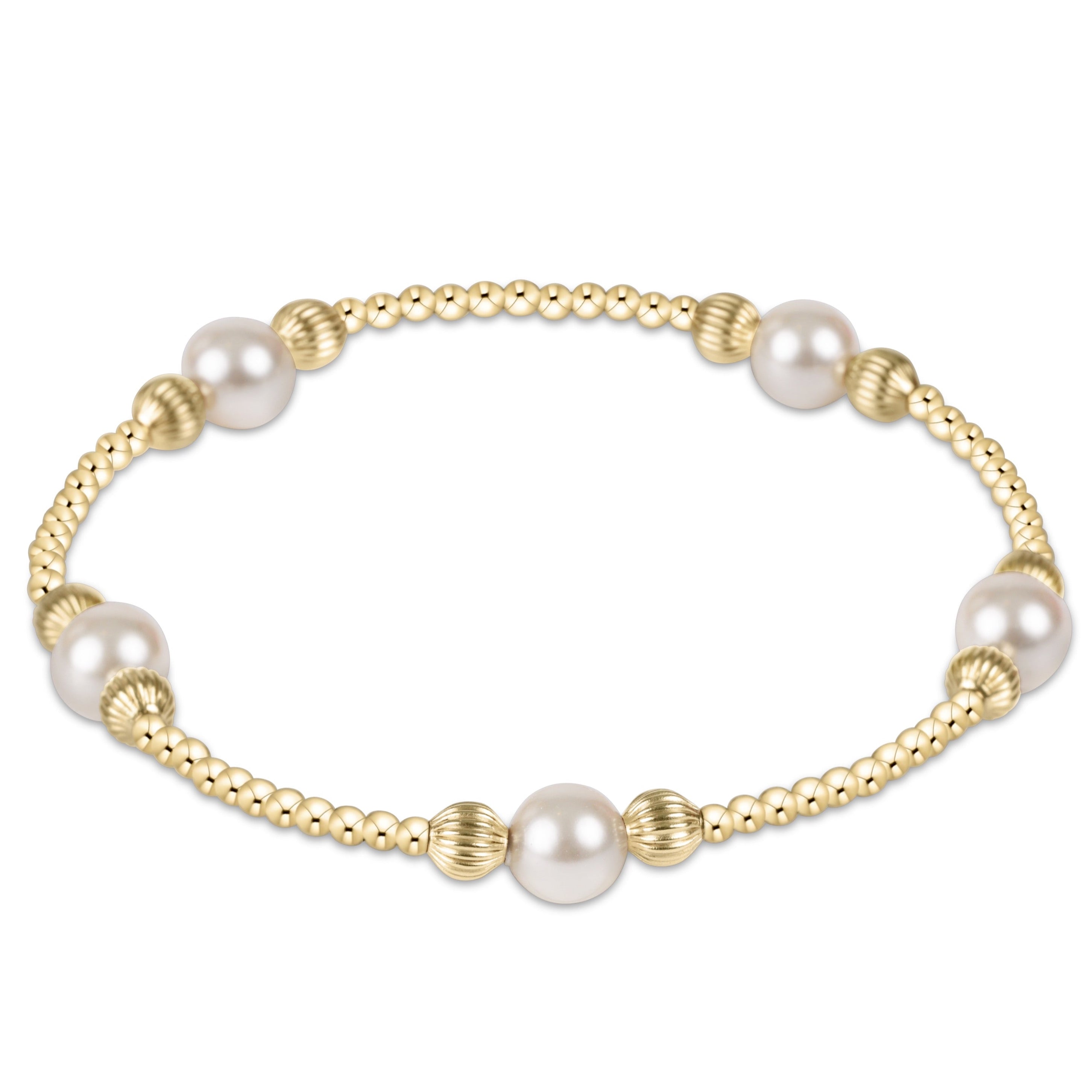 Gold and pearl bracelet on a white background