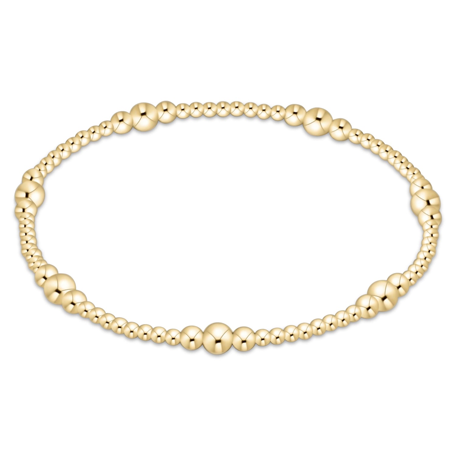 Gold beaded bracelet on a white background