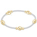 Gold and silver beaded bracelet on a white background