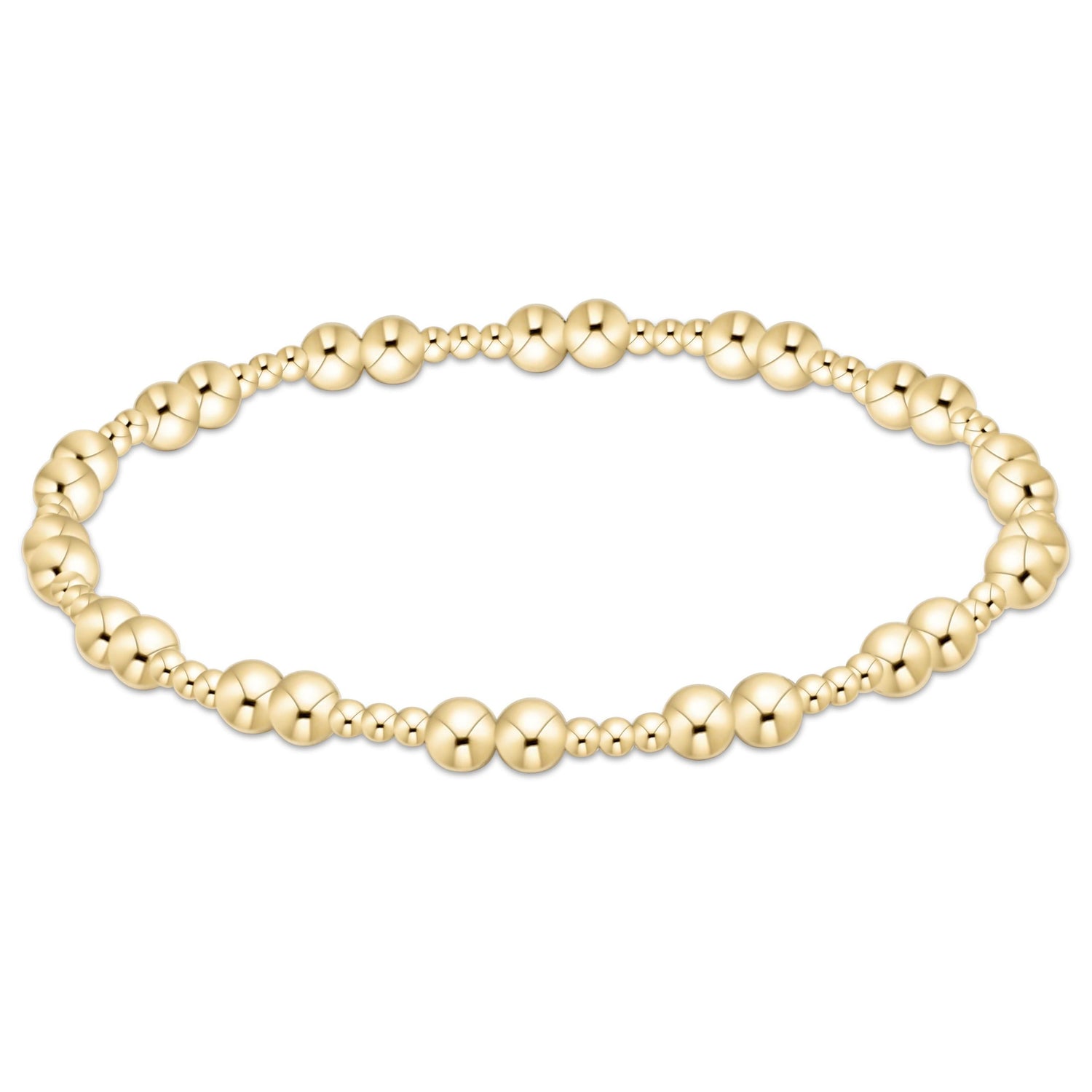 Gold beaded bracelet on a white background