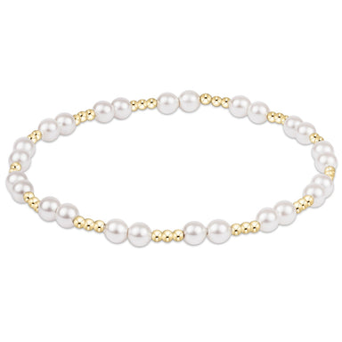 Pearl bracelet with gold accents on a white background