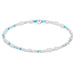 Bracelet with white beads and turquoise accents on a white background