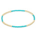 Turquoise and gold beaded bracelet on a white background
