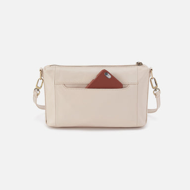 Beige crossbody bag with a phone case on a white background