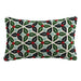 A rectangular lumbar pillow with a pattern of holly leaves and berries in green, red, and black colors.