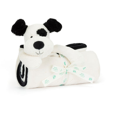 White plush dog toy with black spots and a bow on a white background
