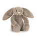 Plush bunny toy with long ears on a white background