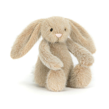 Plush toy rabbit with a soft beige color on a white background