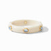 Cream-colored bracelet with gold accents and small stones on a white background