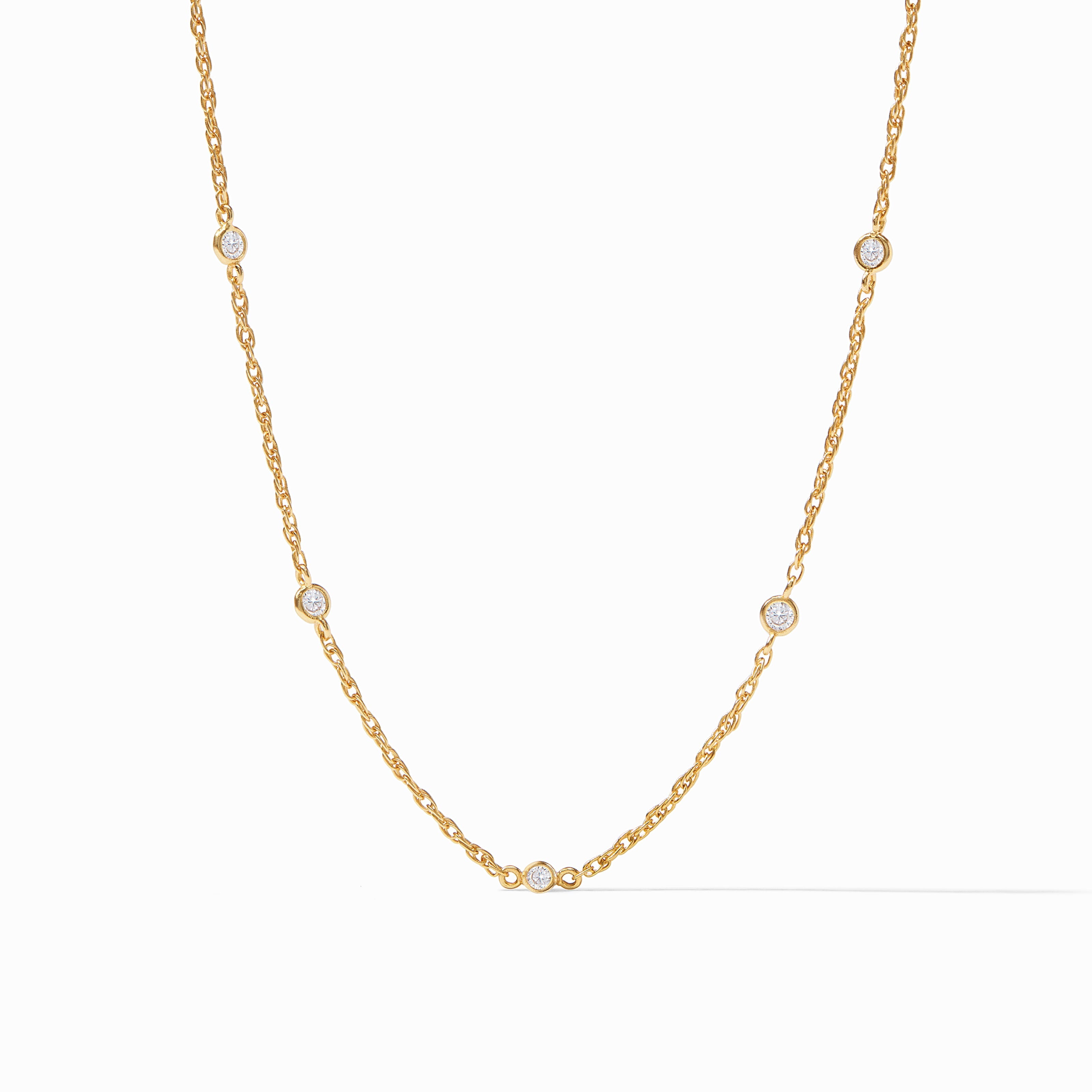 Gold necklace with small diamonds on a white background